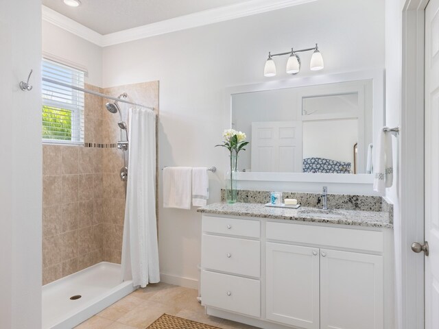 bathroom with vanity, tile patterned floors, curtained shower, and ornamental molding