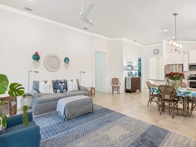 living room featuring light tile patterned flooring, ceiling fan with notable chandelier, and crown molding