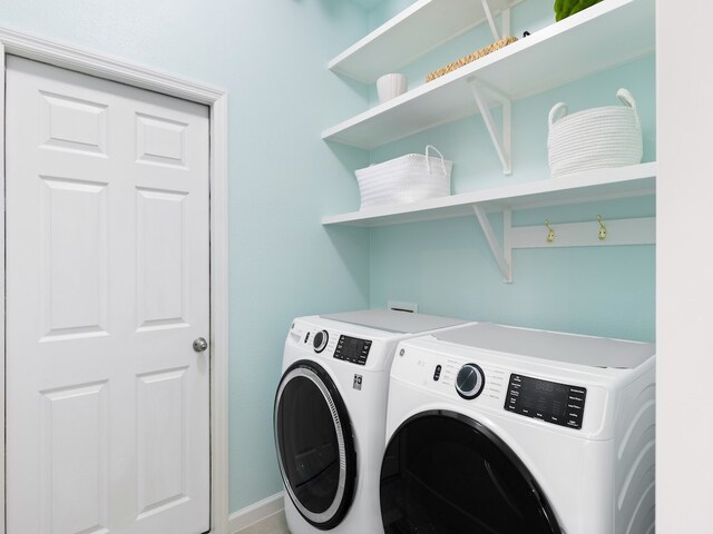 washroom featuring independent washer and dryer