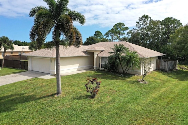 ranch-style house with a front yard, concrete driveway, an attached garage, and stucco siding