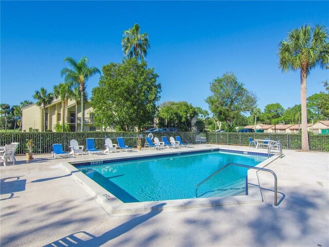 view of swimming pool featuring a patio area