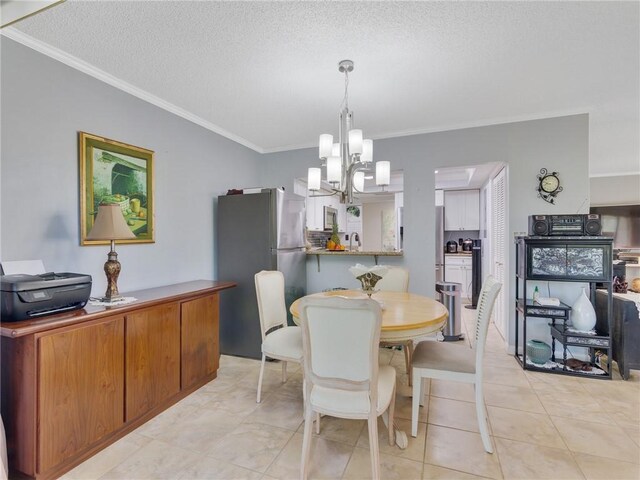 tiled dining space with crown molding, a chandelier, and a textured ceiling