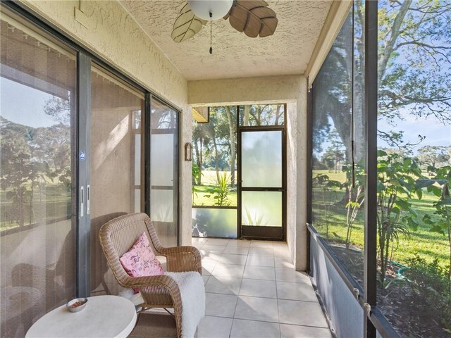 sunroom / solarium with ceiling fan