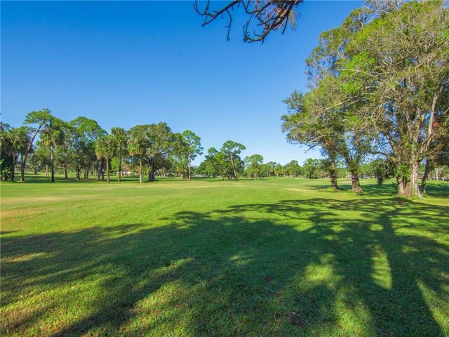 view of property's community featuring a yard