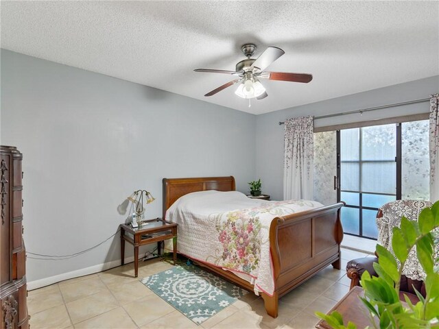 tiled bedroom featuring access to exterior, ceiling fan, and a textured ceiling