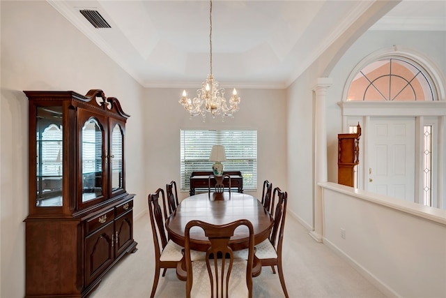 dining room with visible vents, baseboards, light colored carpet, a tray ceiling, and an inviting chandelier