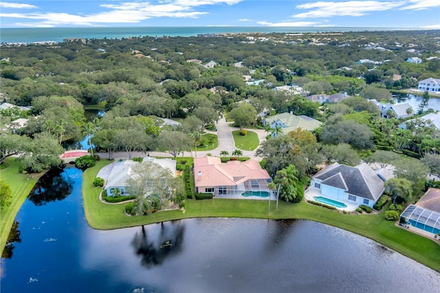 birds eye view of property featuring a water view