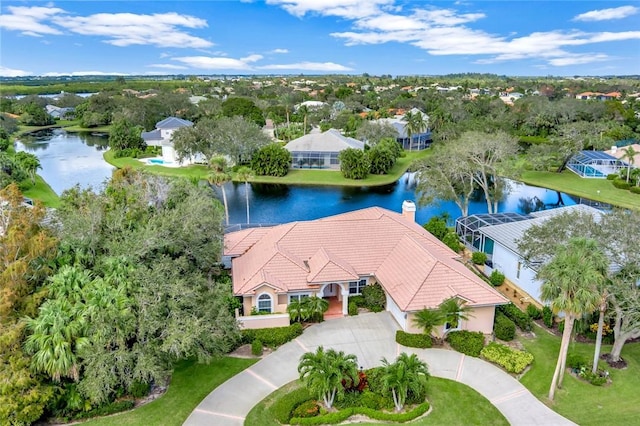 birds eye view of property with a water view