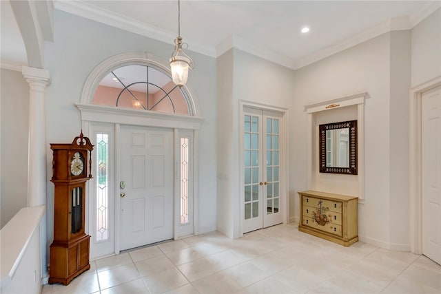 foyer entrance with baseboards, light tile patterned flooring, recessed lighting, french doors, and crown molding