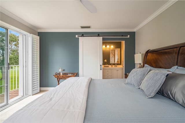 bedroom with access to exterior, a barn door, ensuite bathroom, ceiling fan, and crown molding