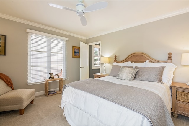 carpeted bedroom featuring multiple windows, ceiling fan, and crown molding