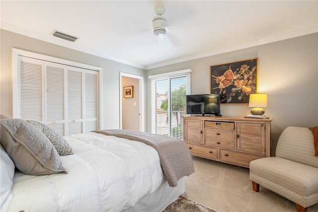 carpeted bedroom with ceiling fan, ornamental molding, a closet, and access to outside