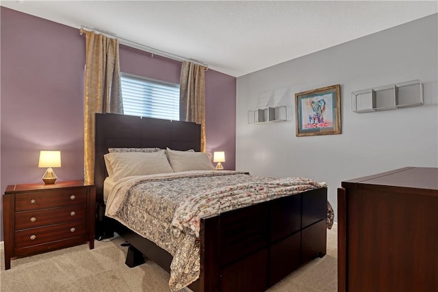 bedroom featuring light colored carpet