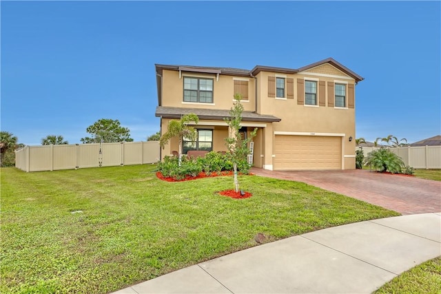 view of front of house with a garage and a front lawn