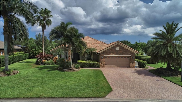 ranch-style home with a garage and a front lawn