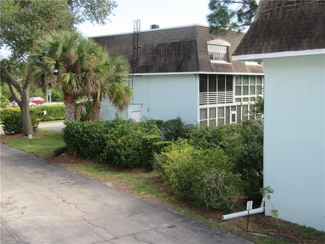 view of side of property with a sunroom