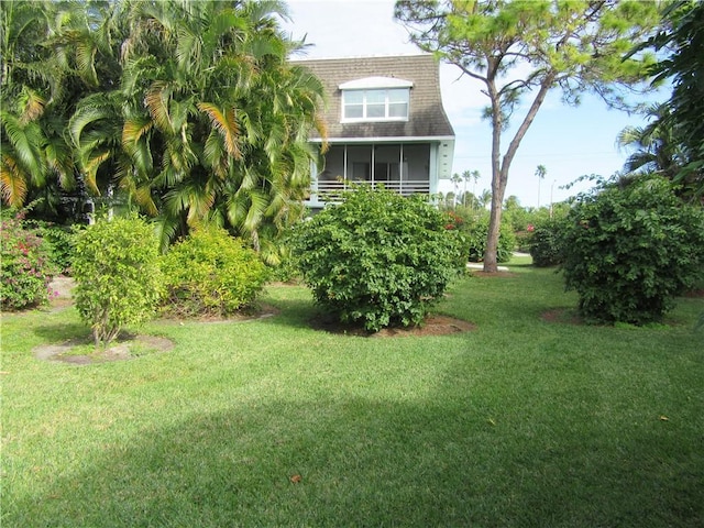 view of yard featuring a sunroom