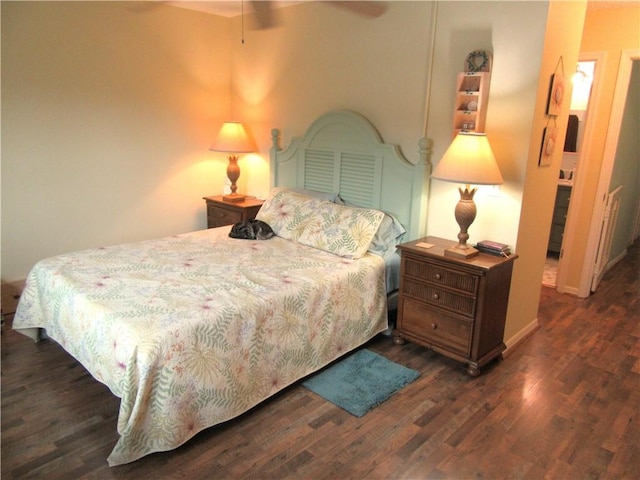 bedroom with ceiling fan and dark wood-type flooring