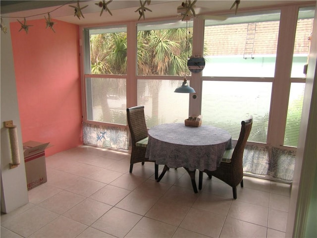 sunroom / solarium with a water view