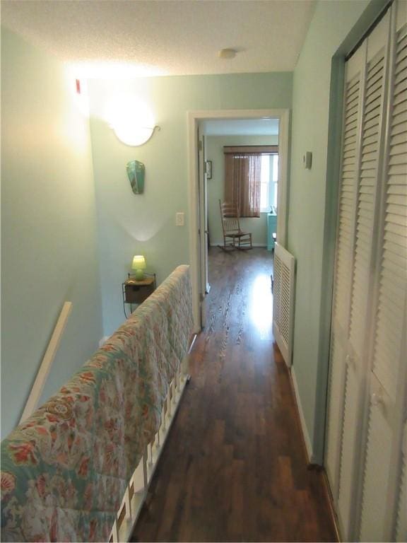 hallway featuring dark hardwood / wood-style flooring