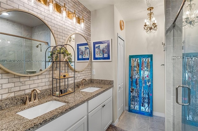 bathroom featuring a notable chandelier, a sink, backsplash, and a shower stall