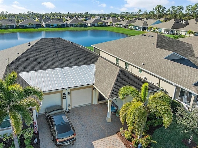 aerial view with a water view and a residential view