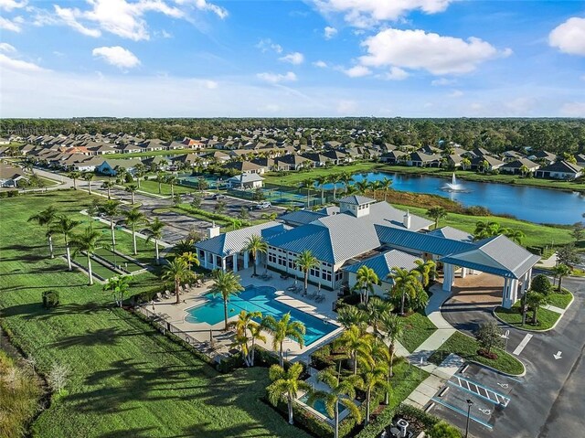 birds eye view of property featuring a water view and a residential view