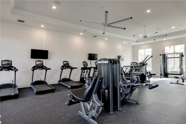 gym with ornamental molding and ceiling fan