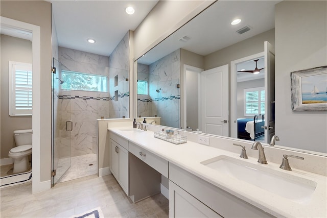 bathroom with walk in shower, tile patterned floors, vanity, and toilet