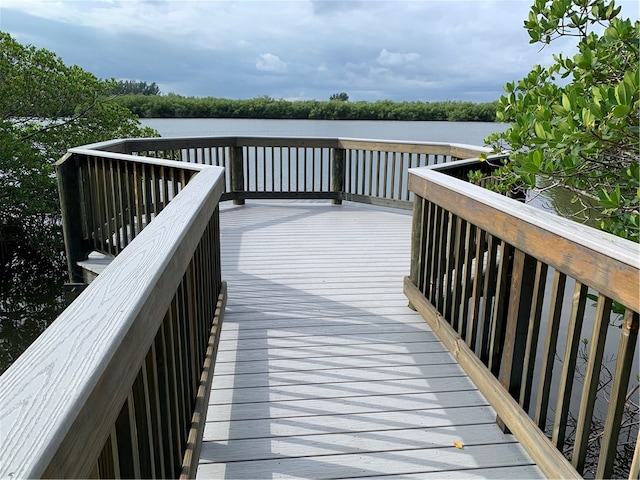 wooden deck with a water view