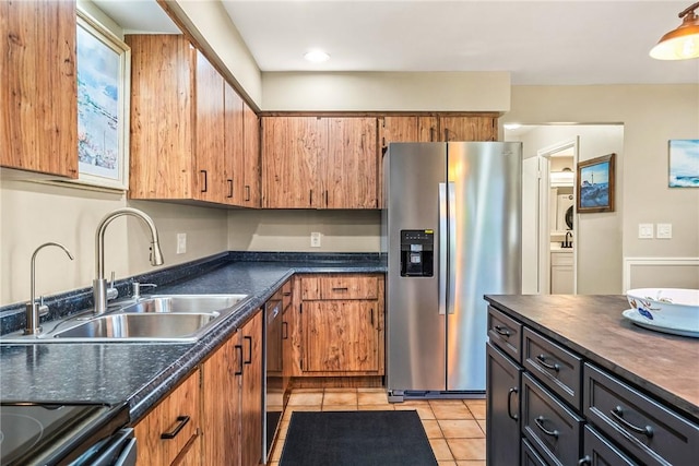 kitchen featuring sink, light tile patterned floors, and stainless steel appliances