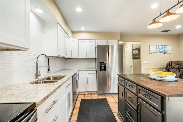 4019 Silver Palm Dr Unit 8, Vero Beach, FL 32963 - kitchen with visible vents, a sink, white cabinetry, and appliances with stainless steel finishes
