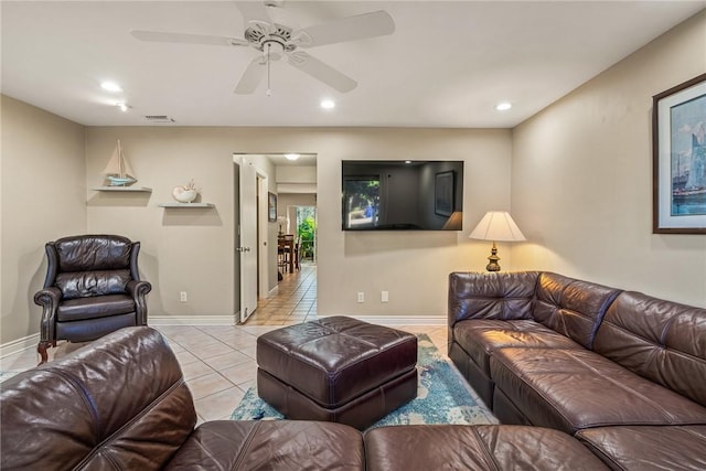 tiled living room featuring ceiling fan