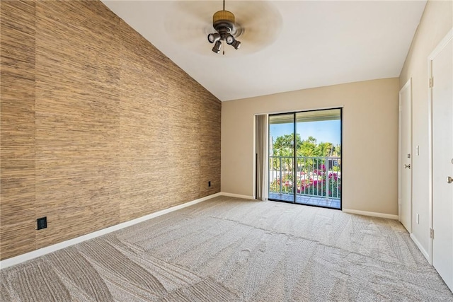 empty room with ceiling fan, light colored carpet, and lofted ceiling