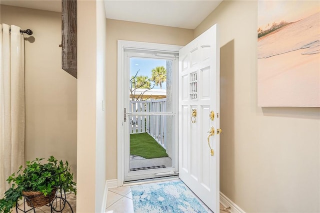 entryway with light tile patterned floors