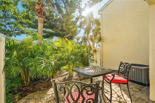 balcony with a patio area and central air condition unit