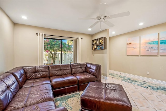 living room featuring light tile patterned flooring and ceiling fan