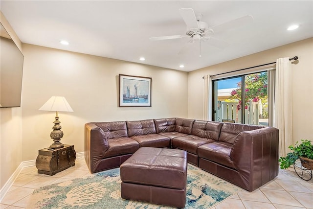 living room featuring ceiling fan and light tile patterned floors