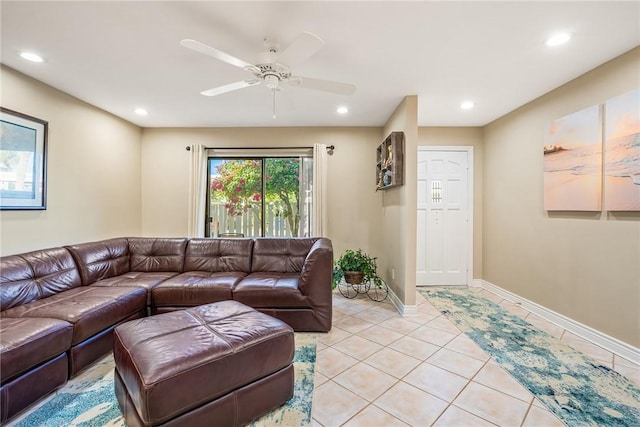 tiled living room with ceiling fan