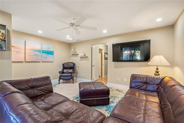 living room featuring ceiling fan and light tile patterned flooring