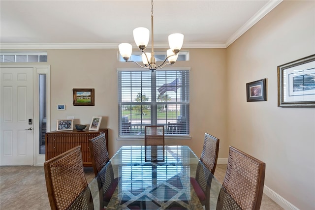 dining room with ornamental molding and a notable chandelier