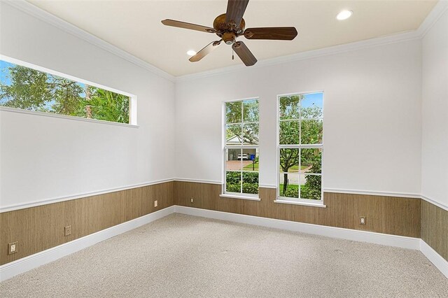 unfurnished sunroom featuring ceiling fan, a water view, and a healthy amount of sunlight