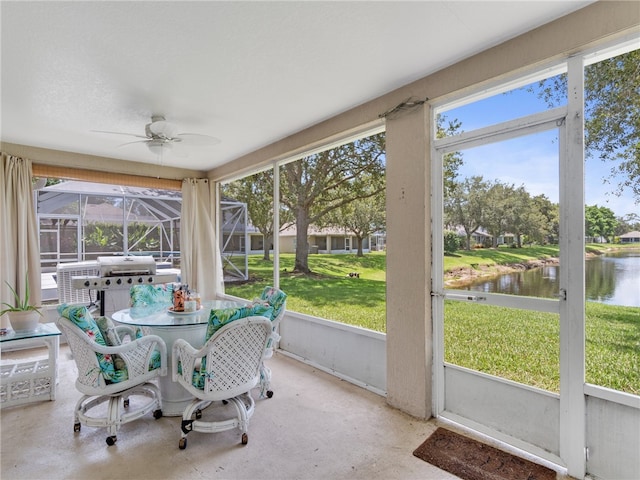 2540 12th Sq SW, Vero Beach, FL 32968 - sunroom featuring a water view, a ceiling fan, and outdoor dining area