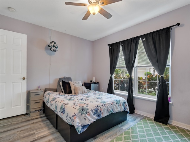 2540 12th Sq SW, Vero Beach, FL 32968 - bedroom with light wood-type flooring and ceiling fan