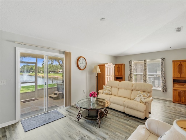 2540 12th Sq SW, Vero Beach, FL 32968 - living area featuring wood finished floors and a water view