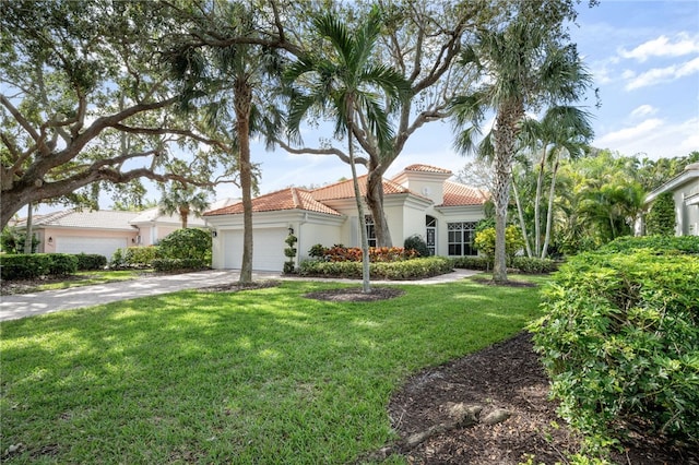 view of front facade featuring a front lawn and a garage