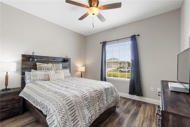 bedroom with ceiling fan and dark hardwood / wood-style flooring