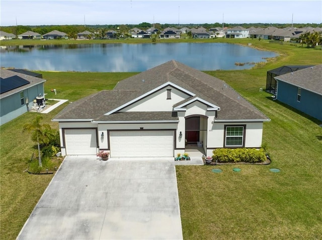 ranch-style house featuring a water view and a garage