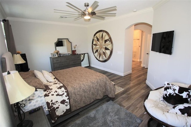 bedroom featuring ceiling fan, dark hardwood / wood-style floors, and ornamental molding