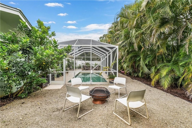 3050 11th Ave, Vero Beach, FL 32960 - view of patio / terrace with an outdoor fire pit, an outdoor pool, and a lanai